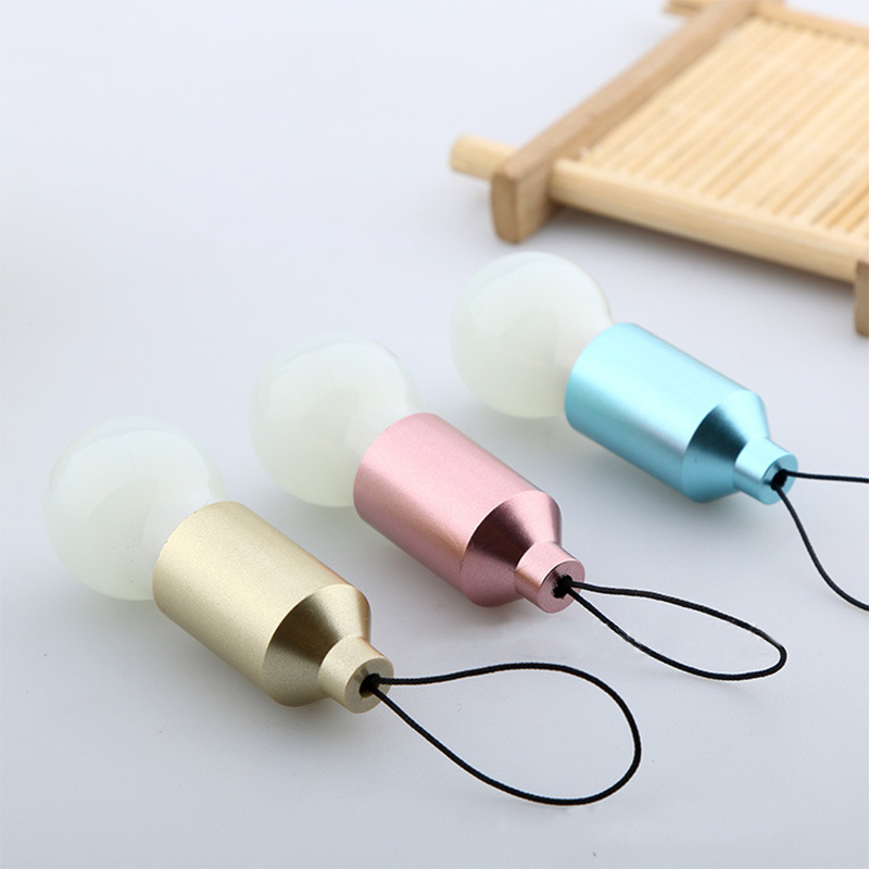 Pull-string switch keychain in the shape of a small LED bulb, 5.5cm, random color
